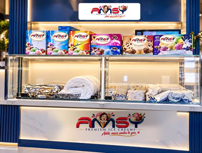 An AMSY in-store ice cream display with cartons on top